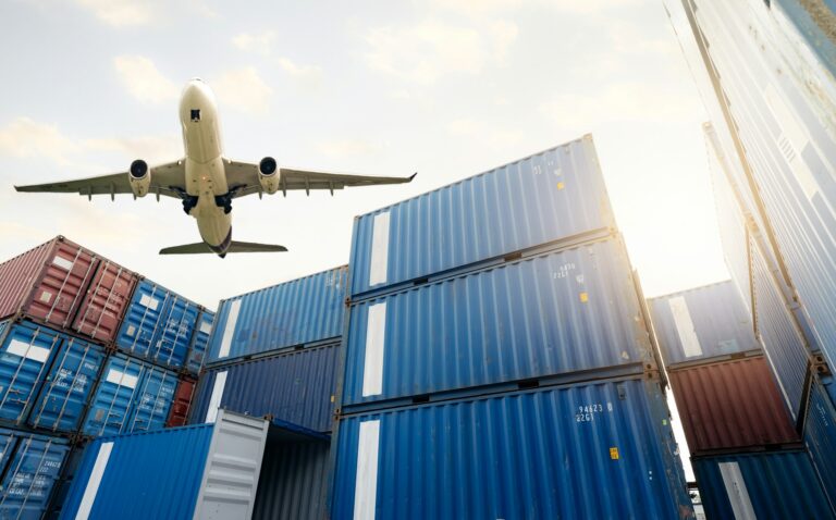 air logistics cargo airplane flying above stack of logistic container cargo and shipping business